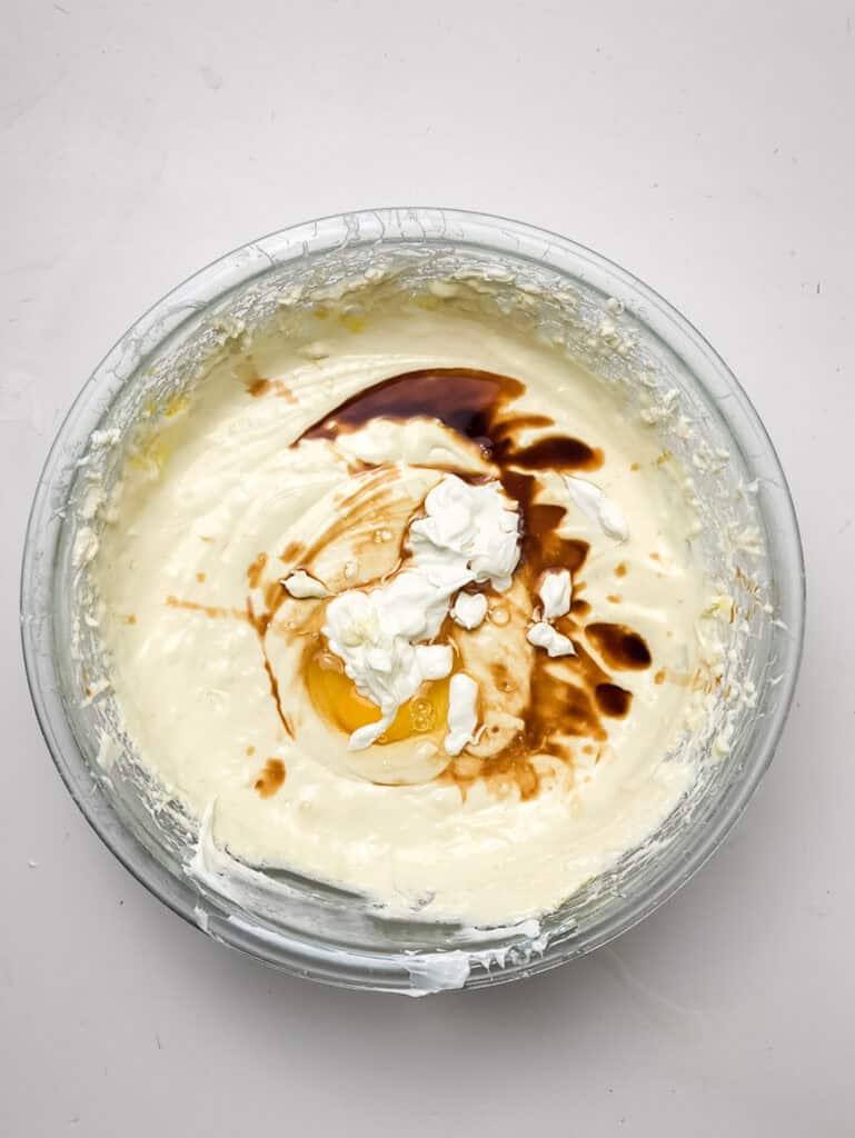 adding vanilla to cheesecake filling for for strawberry crunch cheesecake