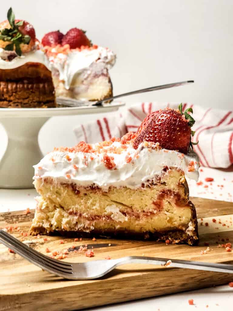 strawberry crunch cheesecake slice on board