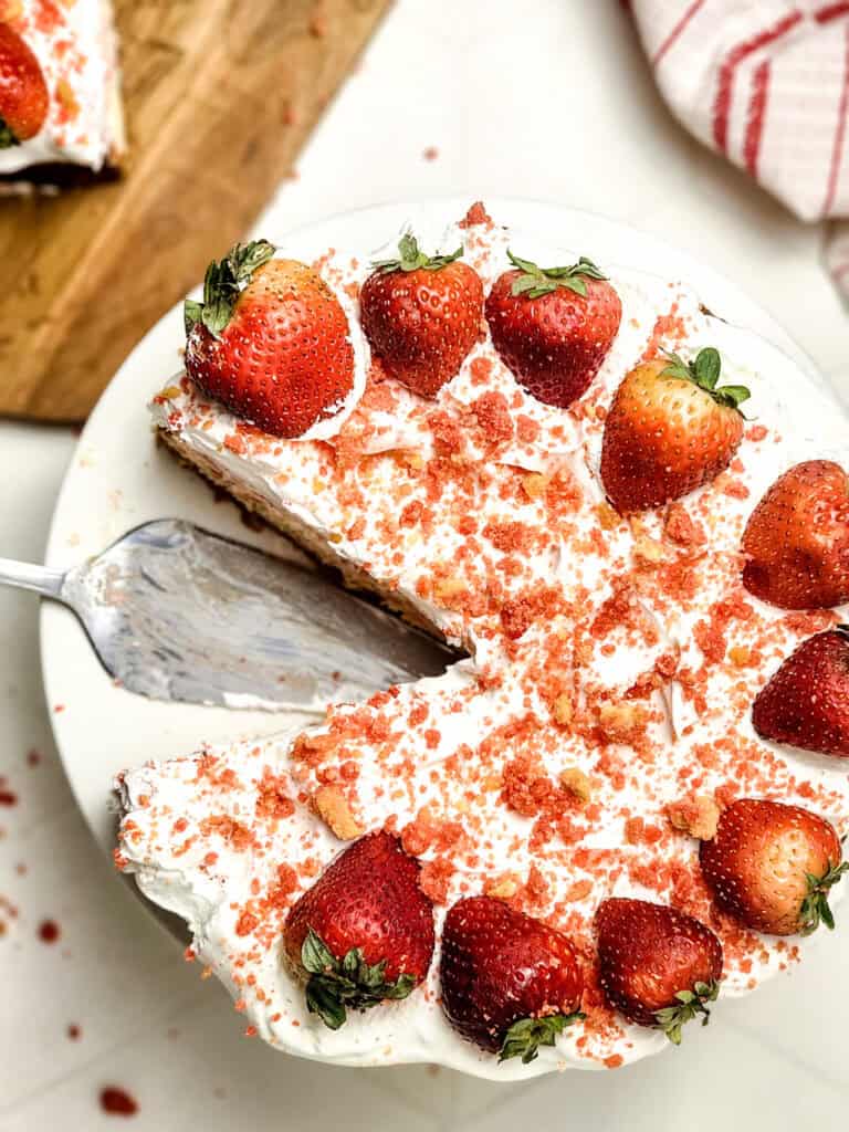 strawberry crunch cheesecake with slice cut out