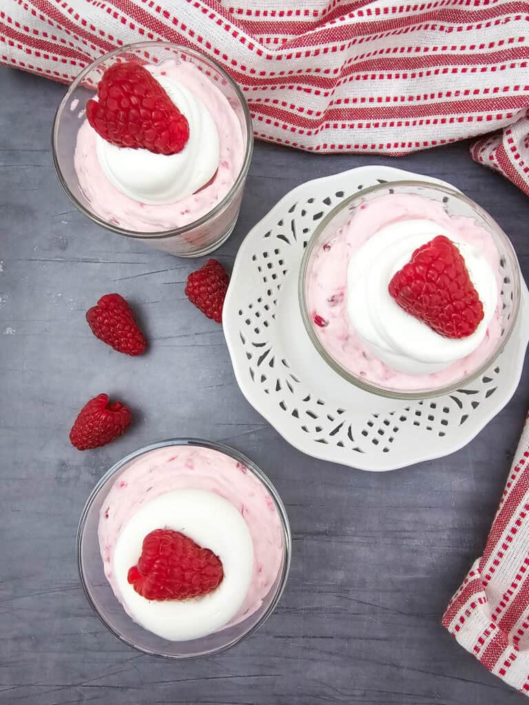 overhead view of no bake raspberry cheesecake parfaits