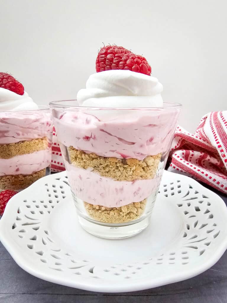 side view of no bake raspberry cheesecake parfaits